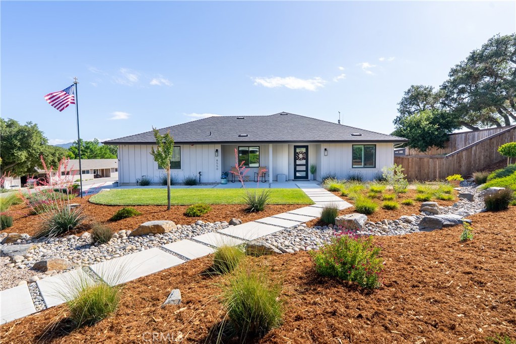 a view of a house with swimming pool and sitting area