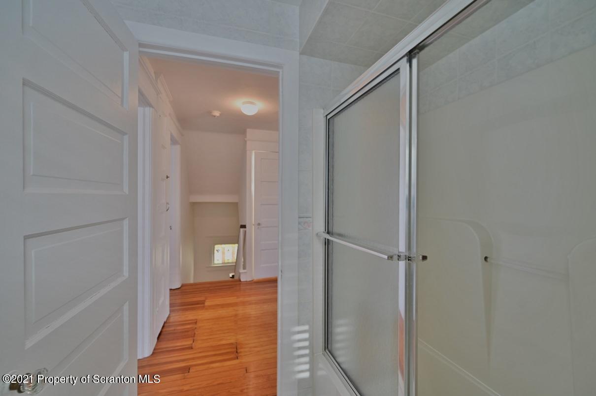 1909 Green Ridge Street Dunmore, PA 18512 - Photo 36 of 50 a bathroom with a shower and a tub