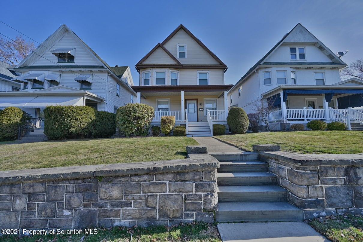 1909 Green Ridge Street Dunmore, PA 18512 - Photo 8 of 50 a front view of a house with garden