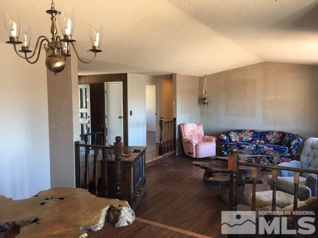 14585 Rim Rock Drive Reno, NV 89521 - Photo 4 of 19 a very nice looking room with many windows