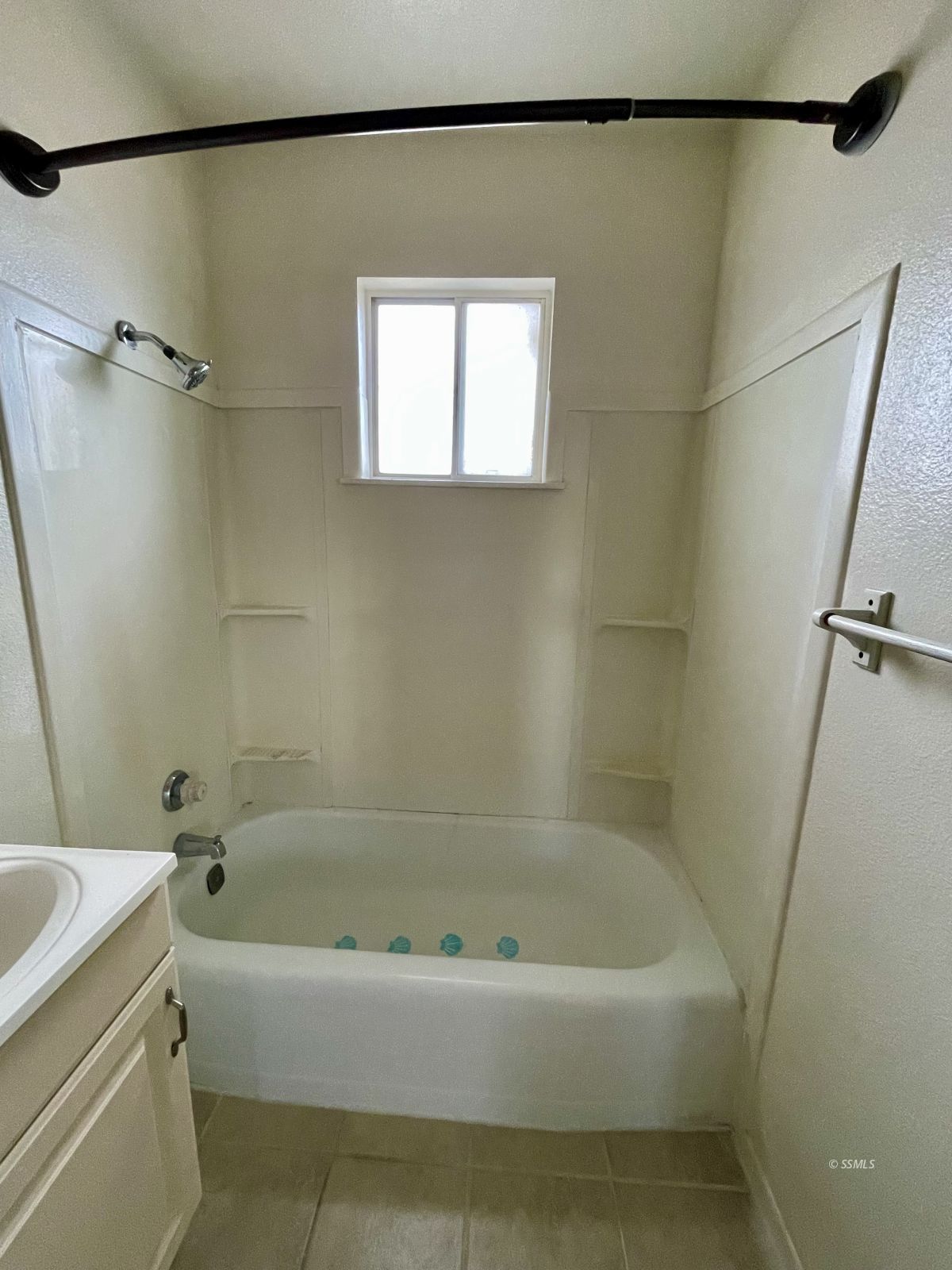 328 North Mono Street Ridgecrest, CA 93555 - Photo 6 of 14 a white bath tub sitting next to a white sink and a shower