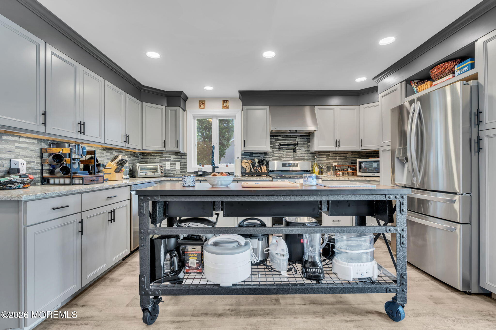 181 Locust Avenue Howell, NJ 07731 - Photo 21 of 66 a kitchen with stainless steel appliances granite countertop a sink a stove a refrigerator and cabinets