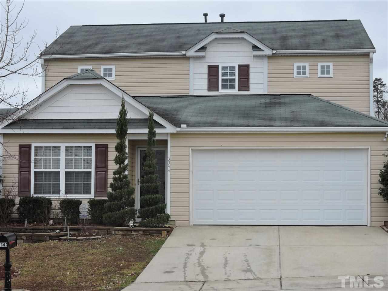 3344 Marshlane Way Raleigh, NC 27610 - Photo 3 of 4 a front view of a house with garage