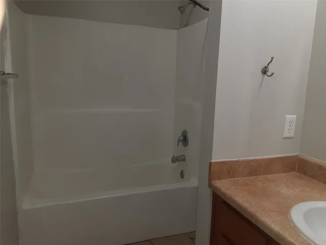 $1 | 134 South Bend Court, Unit B, Willis, TX 77378