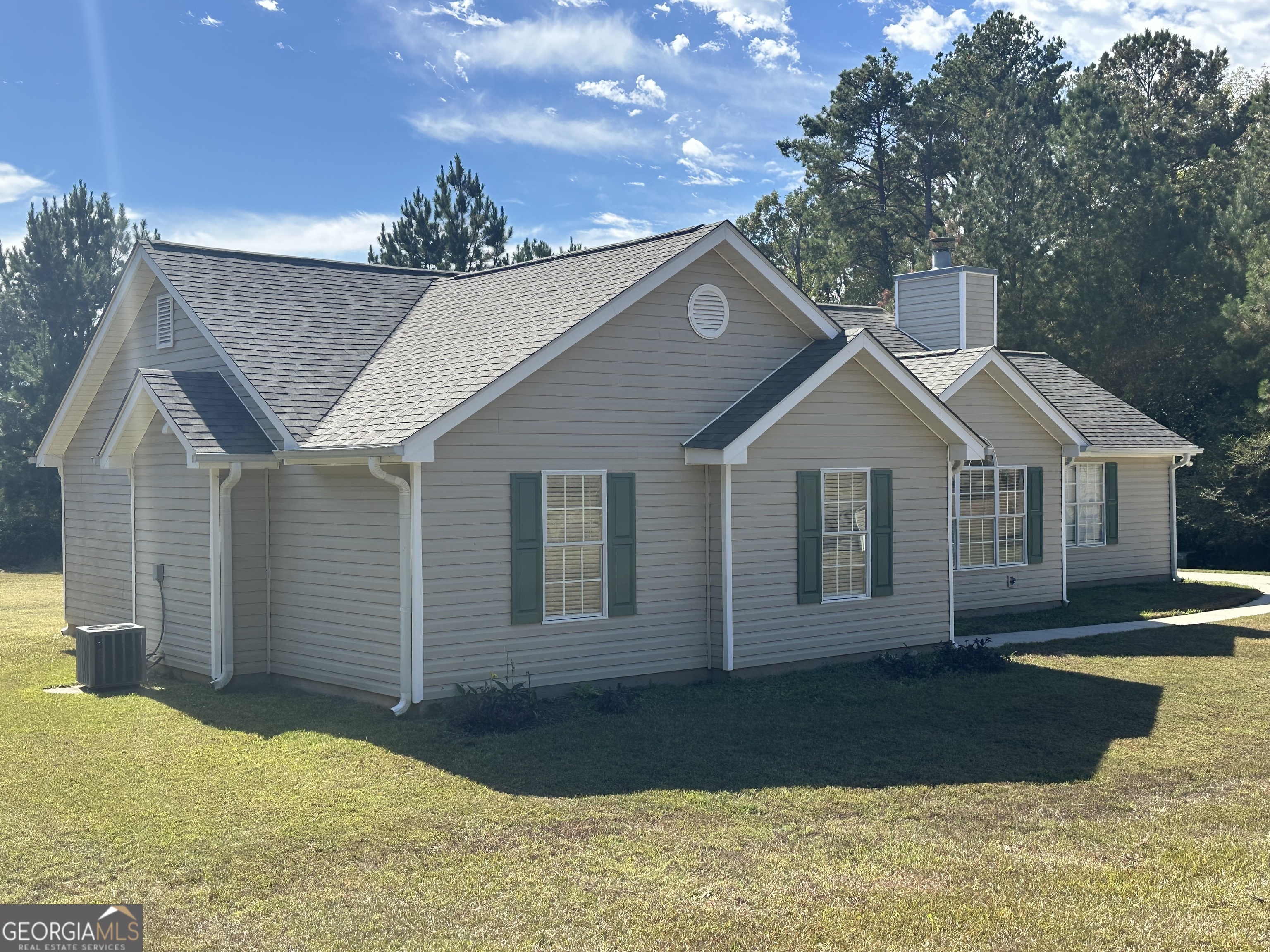 3860 Cedar Rock Road Woodbury, GA 30293 - Photo 2 of 14 a front view of a house with a yard