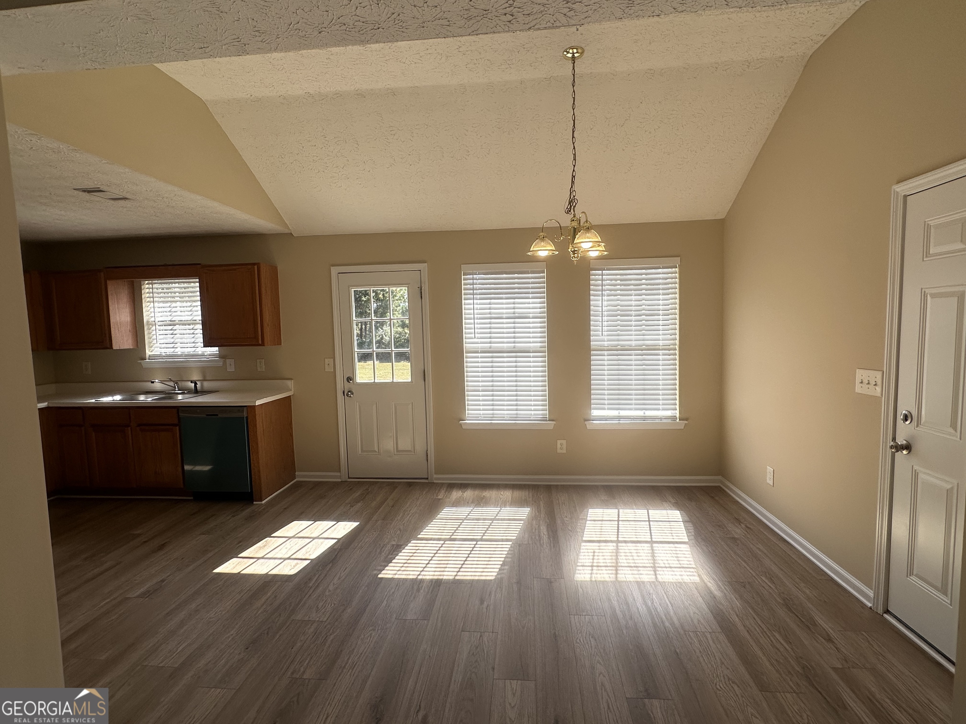 3860 Cedar Rock Road Woodbury, GA 30293 - Photo 3 of 14 a view of kitchen and hall with wooden floor
