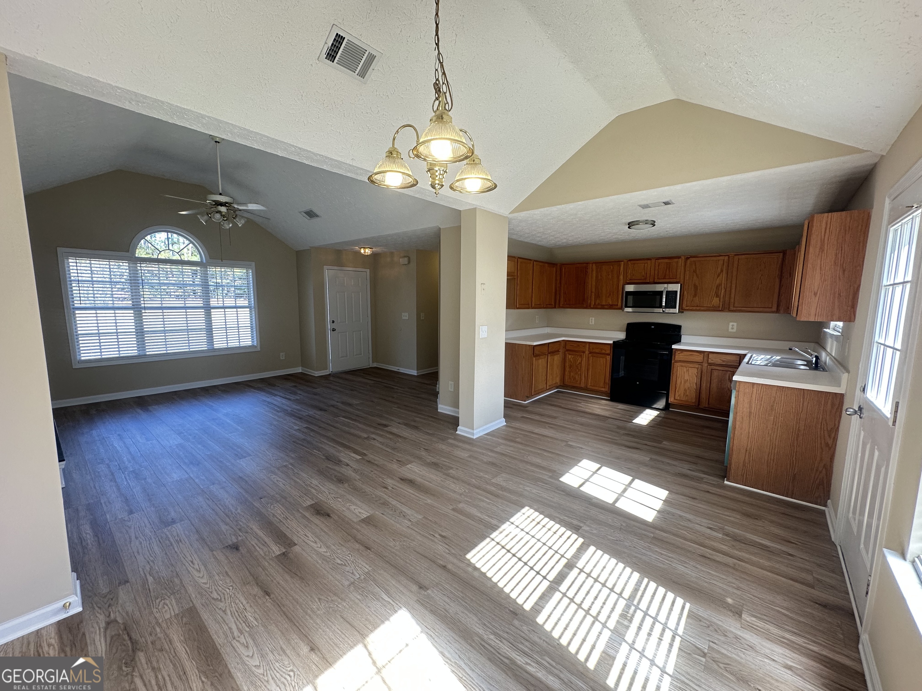 3860 Cedar Rock Road Woodbury, GA 30293 - Photo 5 of 14 a view of a room with wooden floor and windows