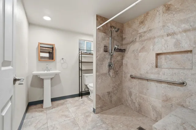 a view of a livingroom with wooden floor and a window