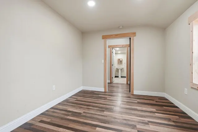 a view of a backyard with wooden fence