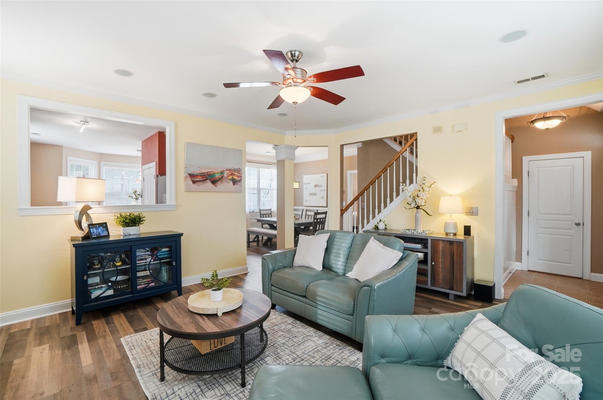 10432 Watoga Way Cornelius, NC 28031 - Photo 11 of 42 a living room with furniture and a wooden floor