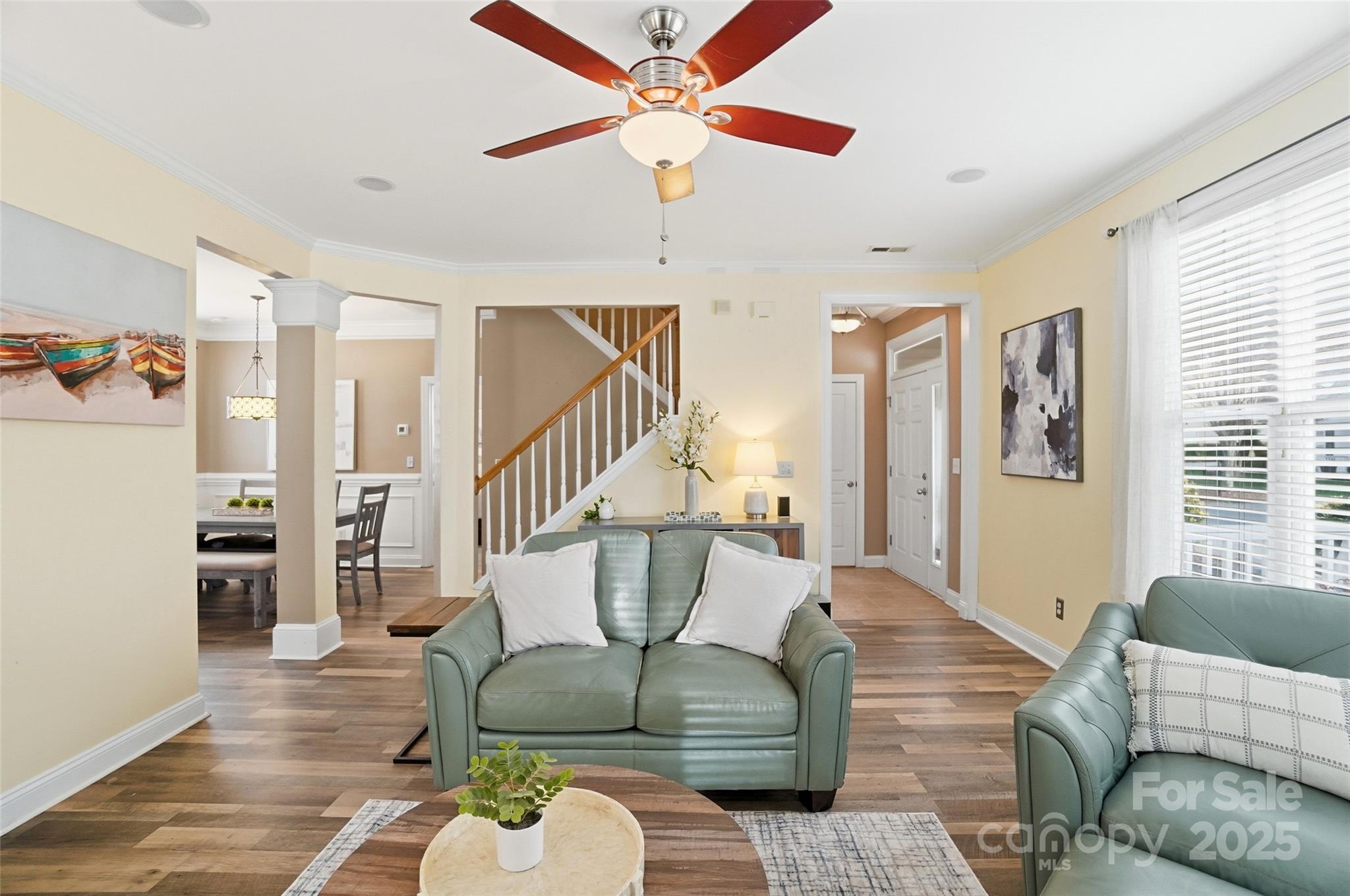 10432 Watoga Way Cornelius, NC 28031 - Photo 13 of 42 a living room with furniture ceiling fan and a rug