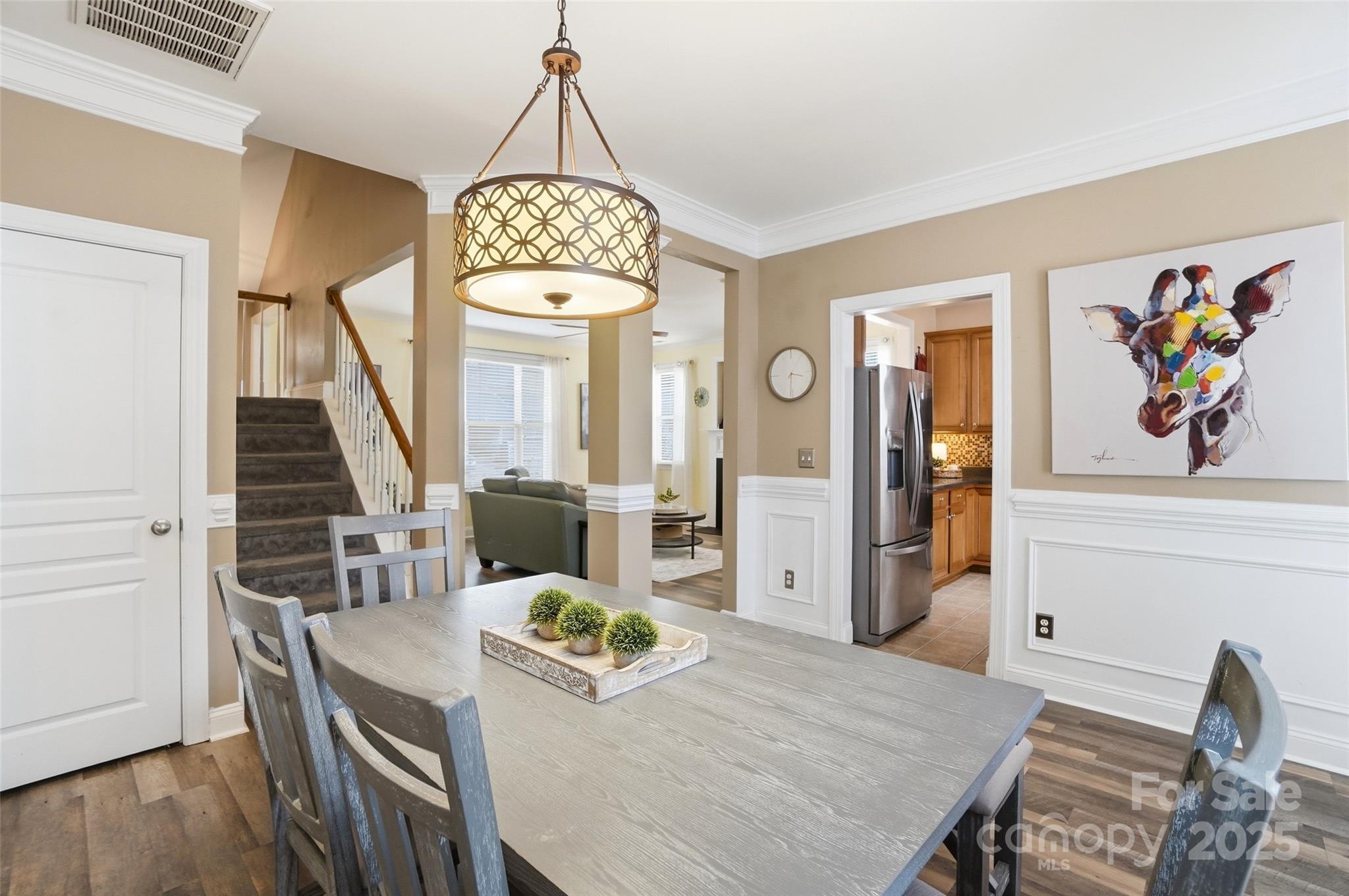 10432 Watoga Way Cornelius, NC 28031 - Photo 17 of 42 a view of a dining room with furniture wooden floor and chandelier