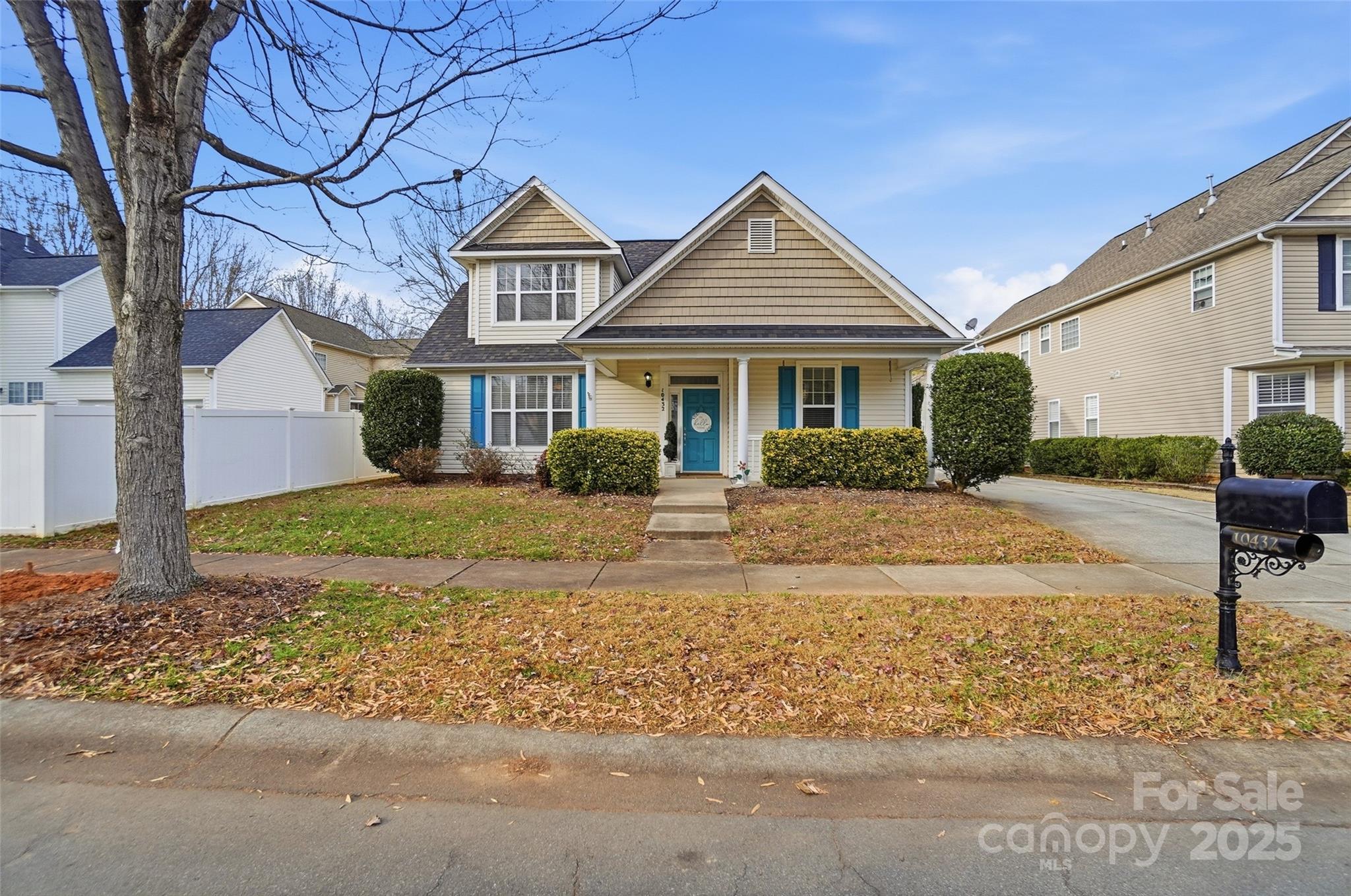 10432 Watoga Way Cornelius, NC 28031 - Photo 2 of 42 a front view of a house with garden
