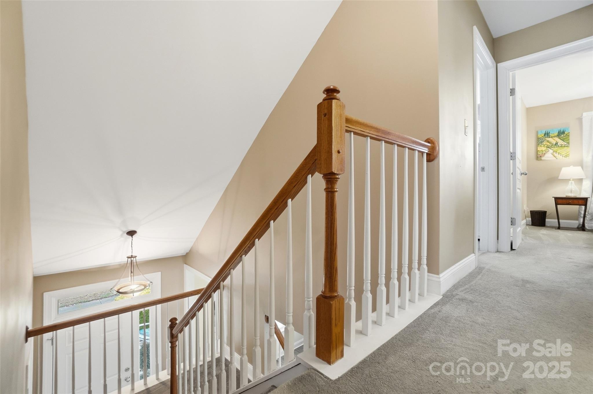 10432 Watoga Way Cornelius, NC 28031 - Photo 30 of 42 a view of staircase with railing and white walls