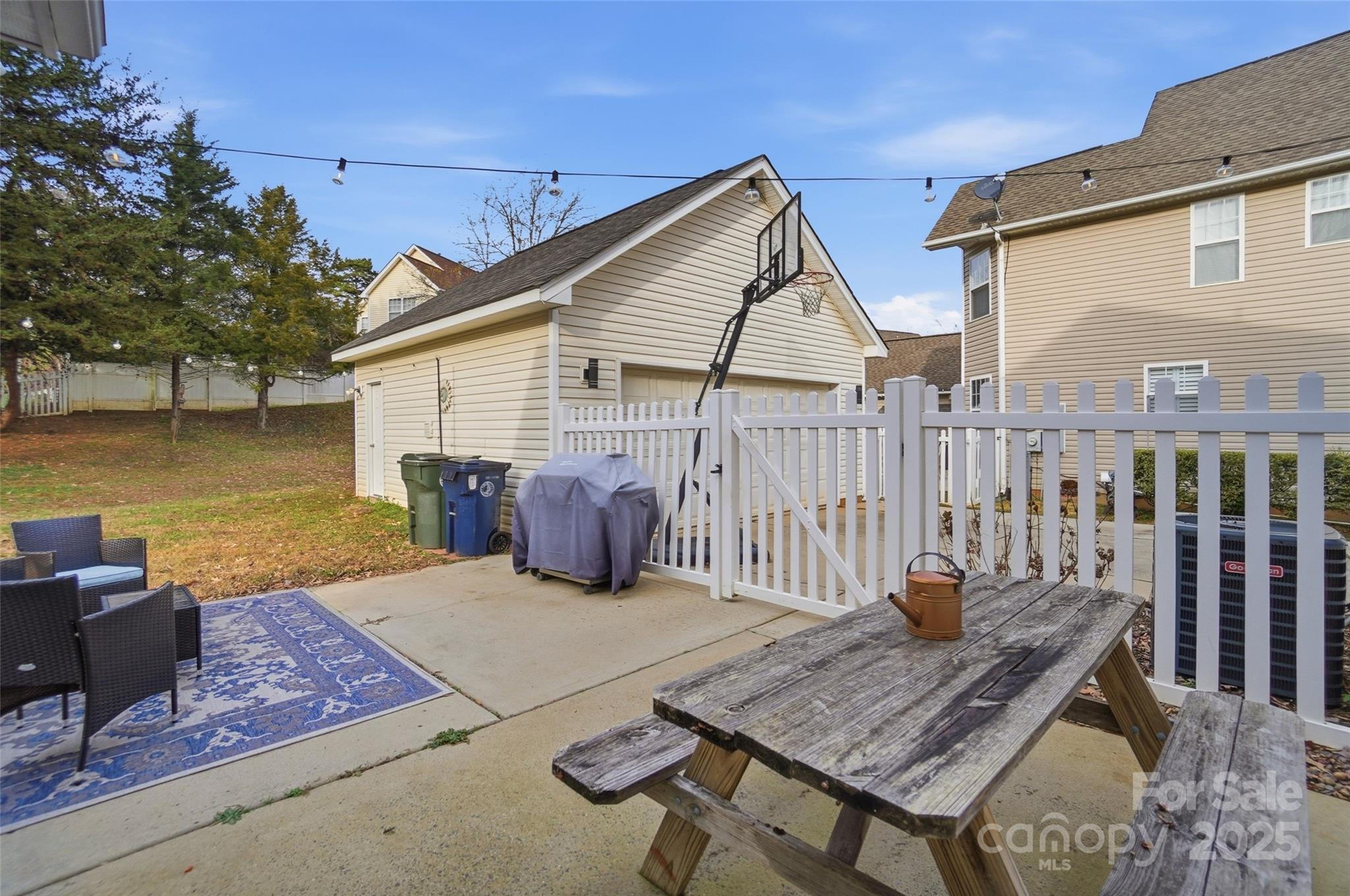 10432 Watoga Way Cornelius, NC 28031 - Photo 37 of 42 a view of a chairs and table on the deck in front of house