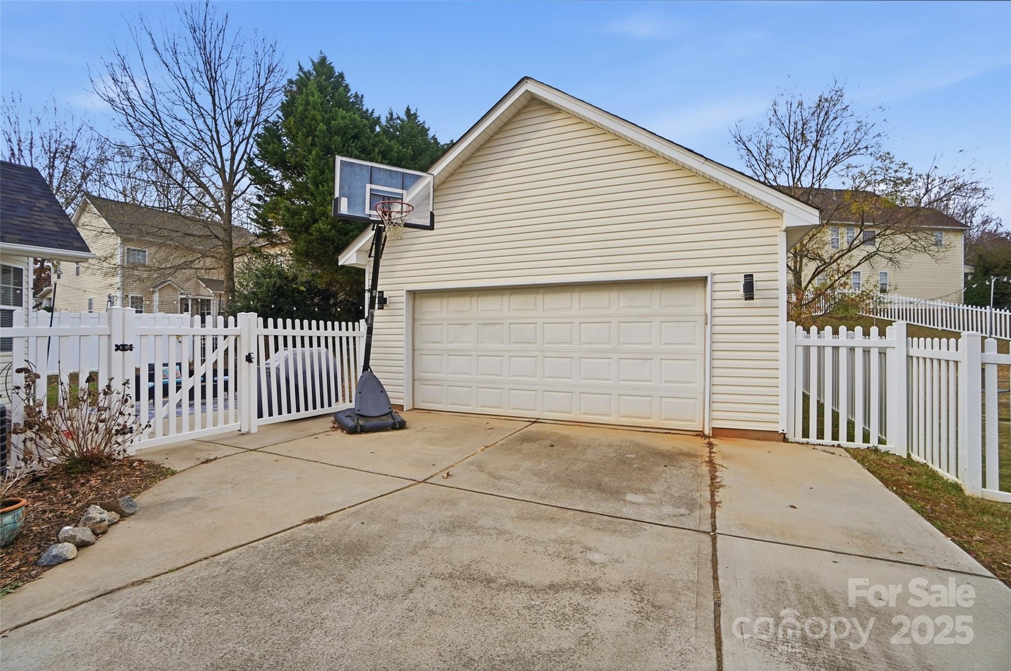 10432 Watoga Way Cornelius, NC 28031 - Photo 42 of 42 a view of a house with a small yard and wooden fence