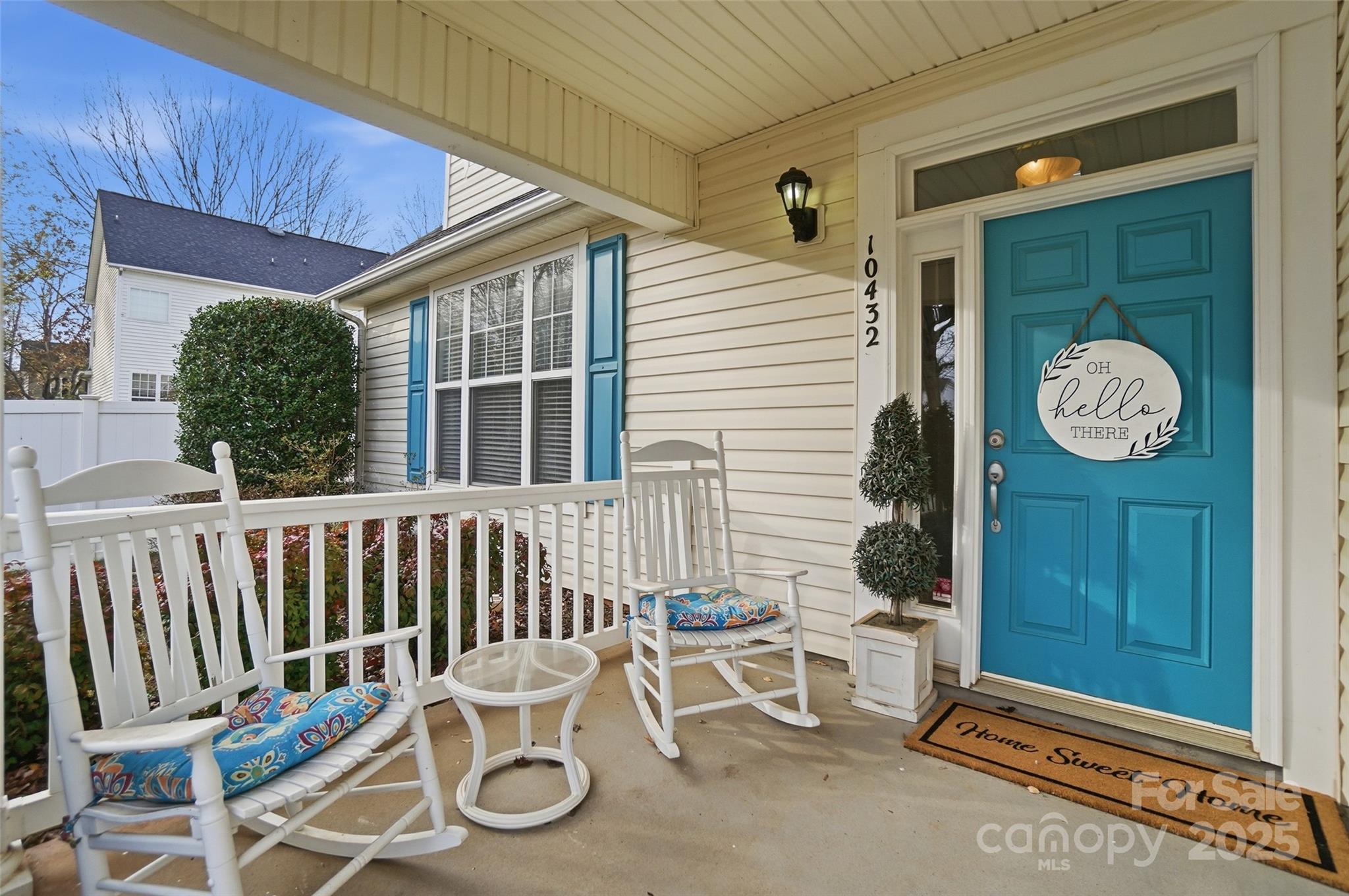 10432 Watoga Way Cornelius, NC 28031 - Photo 5 of 42 a view of a chairs and table in the back yard of the house