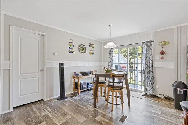a view of a livingroom with furniture window and wooden floor