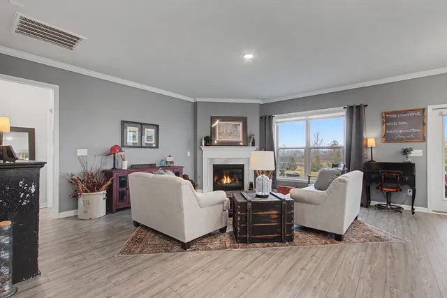 a bed room with a bed and large window