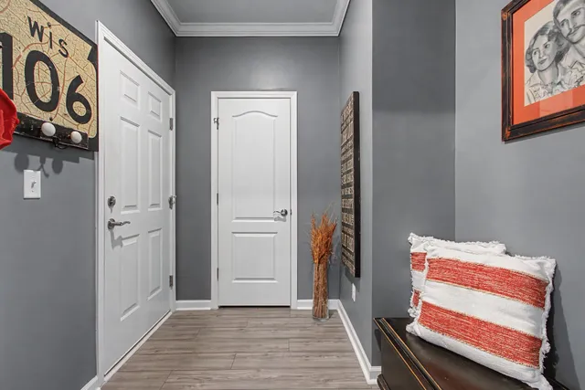 a view of roof deck with lawn chairs and ocean view
