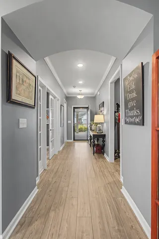 a living room with furniture a window and a flat screen tv