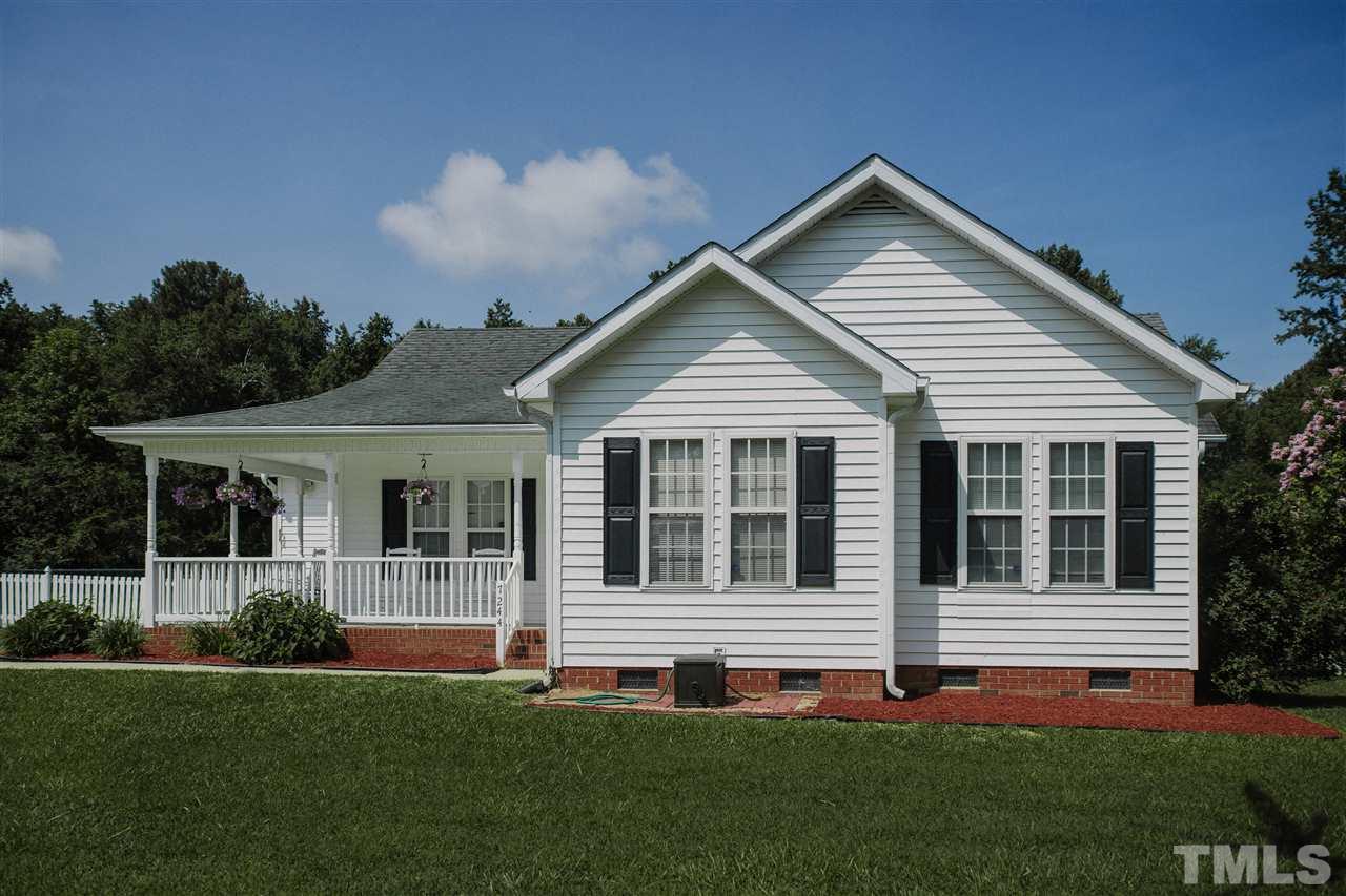 7244 Turner Fish Road Willow Spring, NC 27592 - Photo 1 of 18 a view of a house with a yard