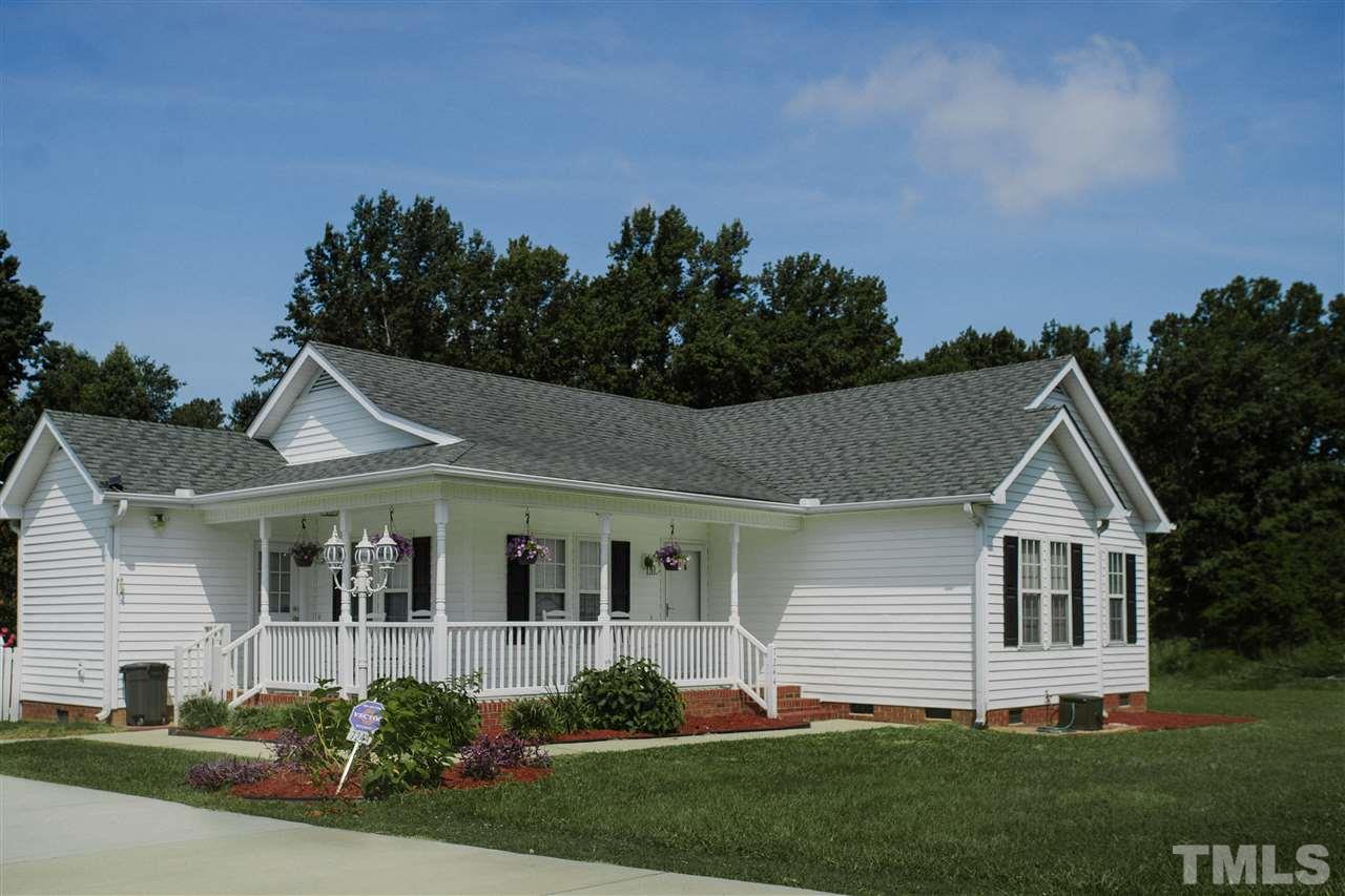 7244 Turner Fish Road Willow Spring, NC 27592 - Photo 2 of 18 a view of a house with a yard