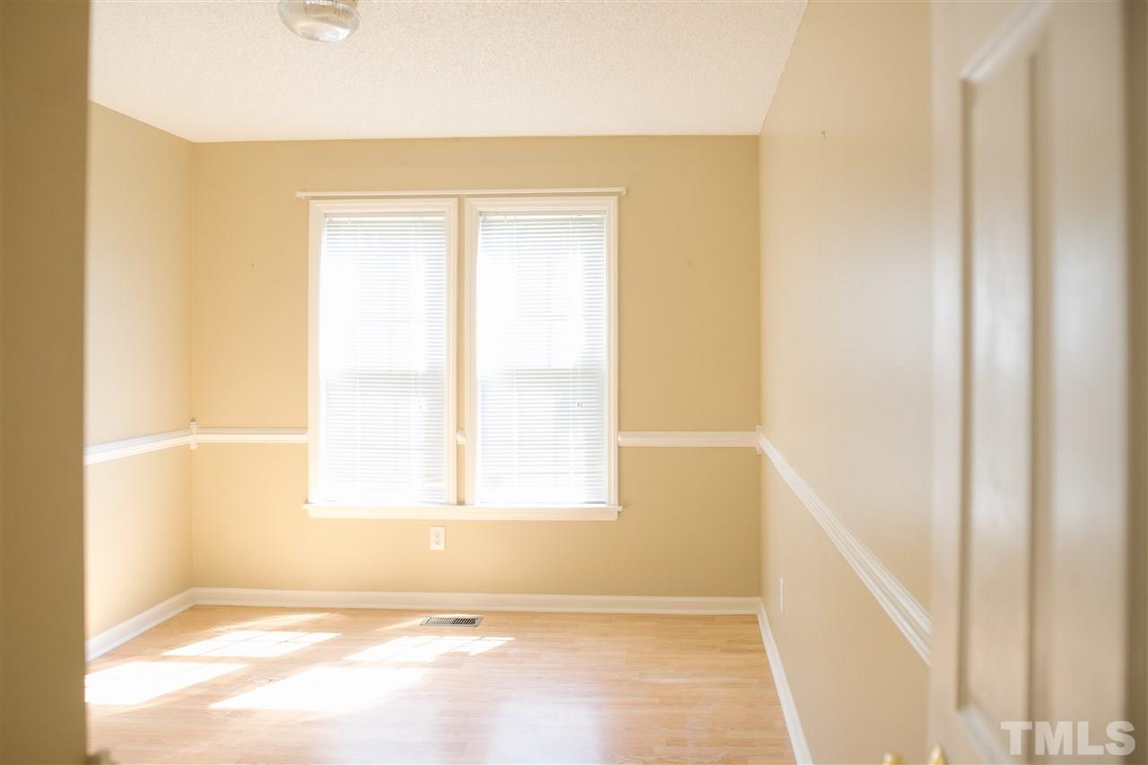 7244 Turner Fish Road Willow Spring, NC 27592 - Photo 14 of 18 a view of an empty room with a window
