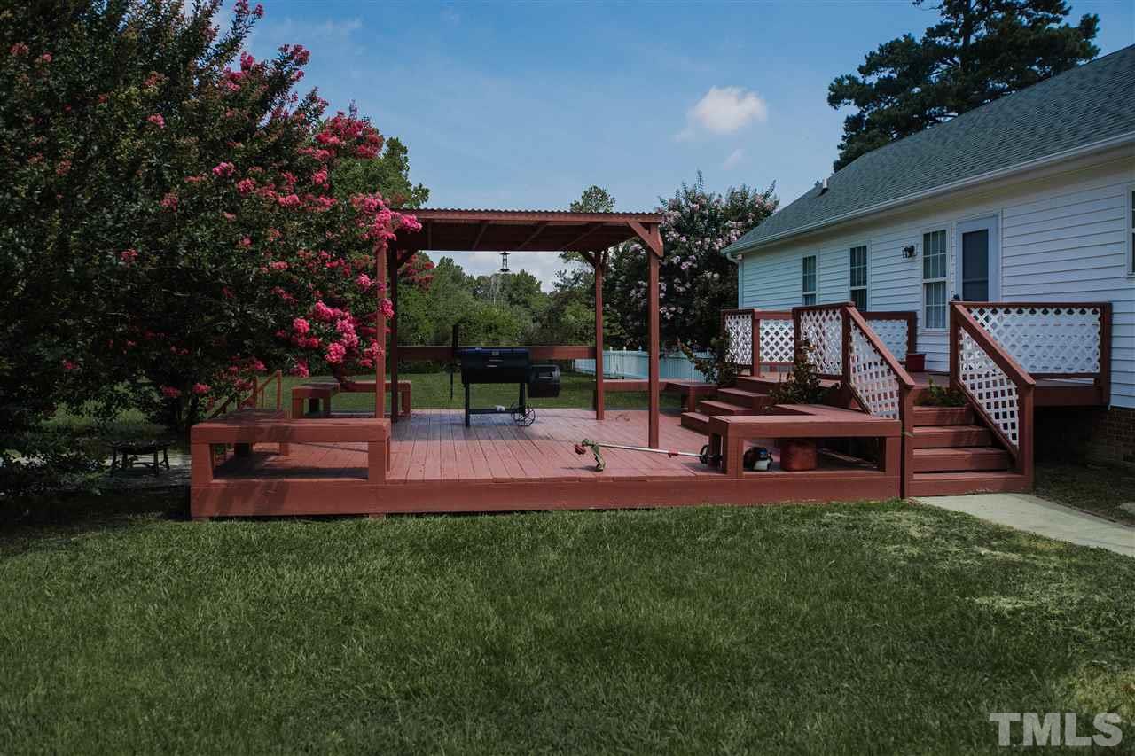 7244 Turner Fish Road Willow Spring, NC 27592 - Photo 17 of 18 a garden view with a seating space