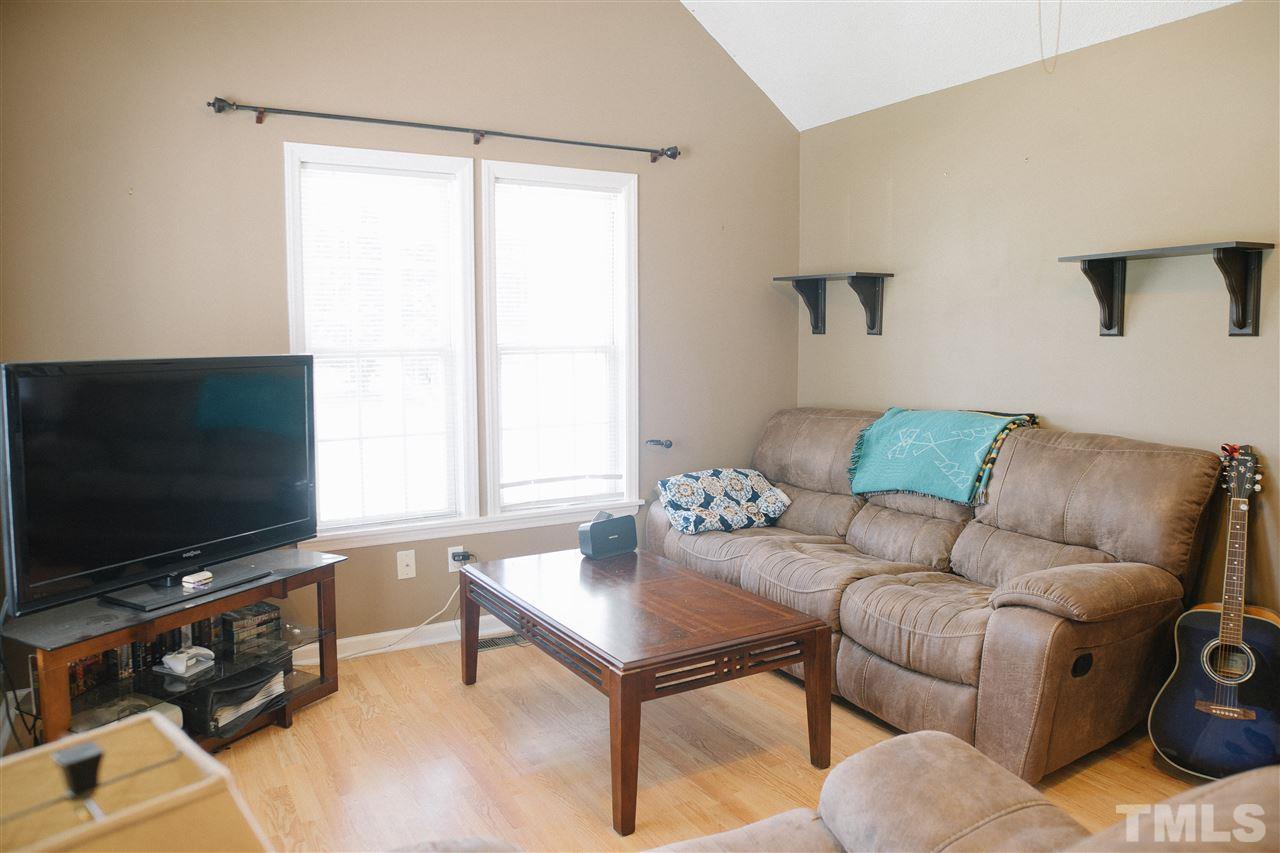 7244 Turner Fish Road Willow Spring, NC 27592 - Photo 3 of 18 a living room with furniture and a flat screen tv