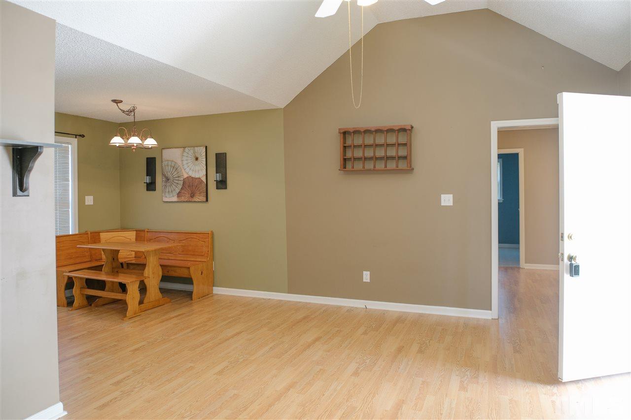 7244 Turner Fish Road Willow Spring, NC 27592 - Photo 8 of 18 a view of a livingroom with furniture and wooden floor