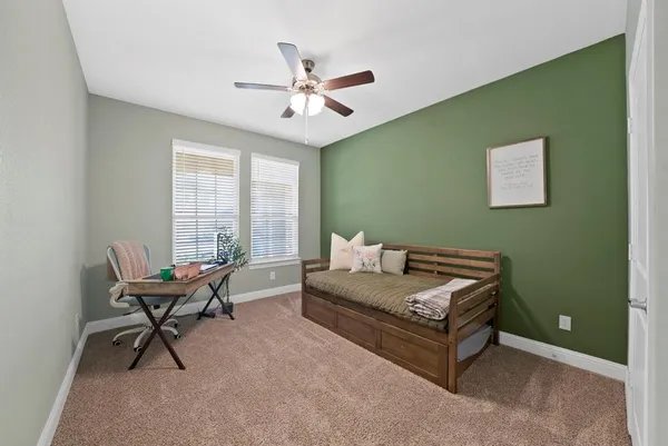 a living room with furniture and windows