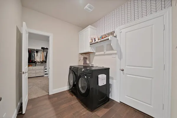 a kitchen with a stove and a refrigerator