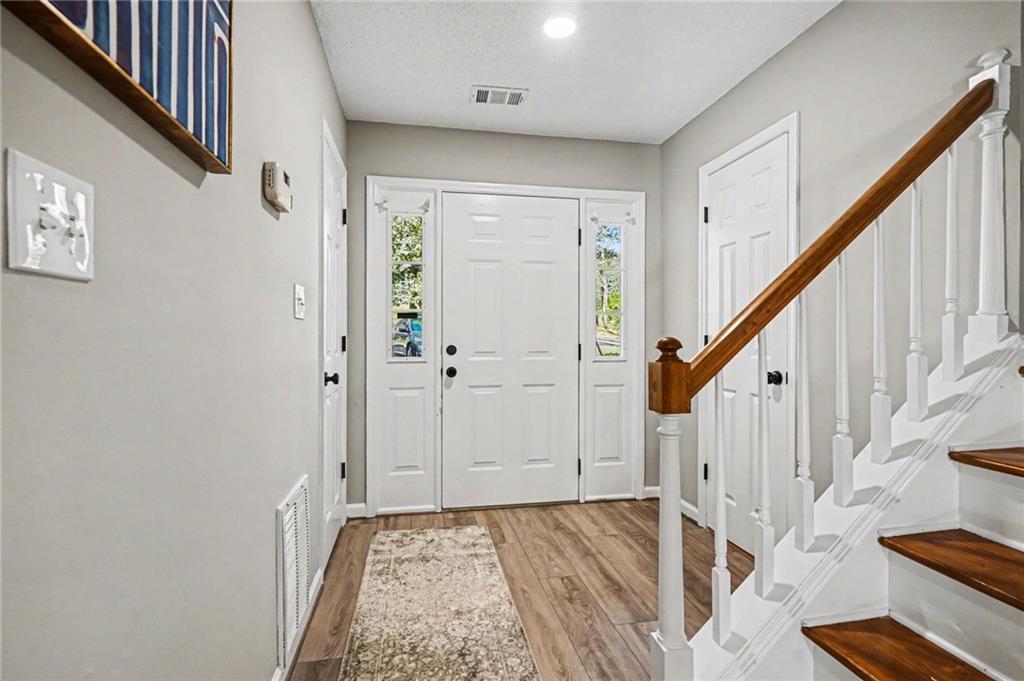 6052 WinterGreen Road Northwest Norcross, GA 30093 - Photo 3 of 24 a view of an entryway with wooden floor