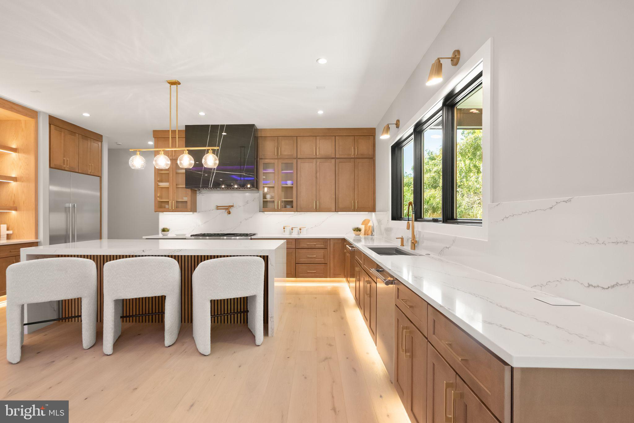 6329 Halsey Road McLean, VA 22101 - Photo 26 of 94 Sleek modern kitchen with warm tones.