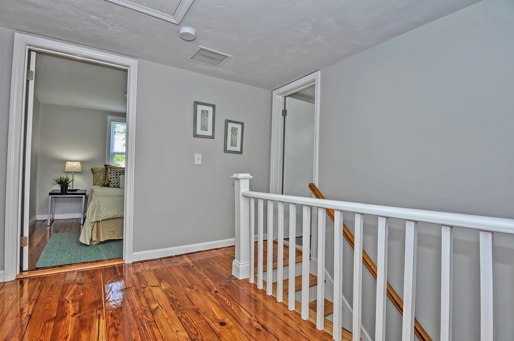 65 Edgewater Avenue Shrewsbury, MA 01545 - Photo 12 of 24 a view of hallway with wooden floor