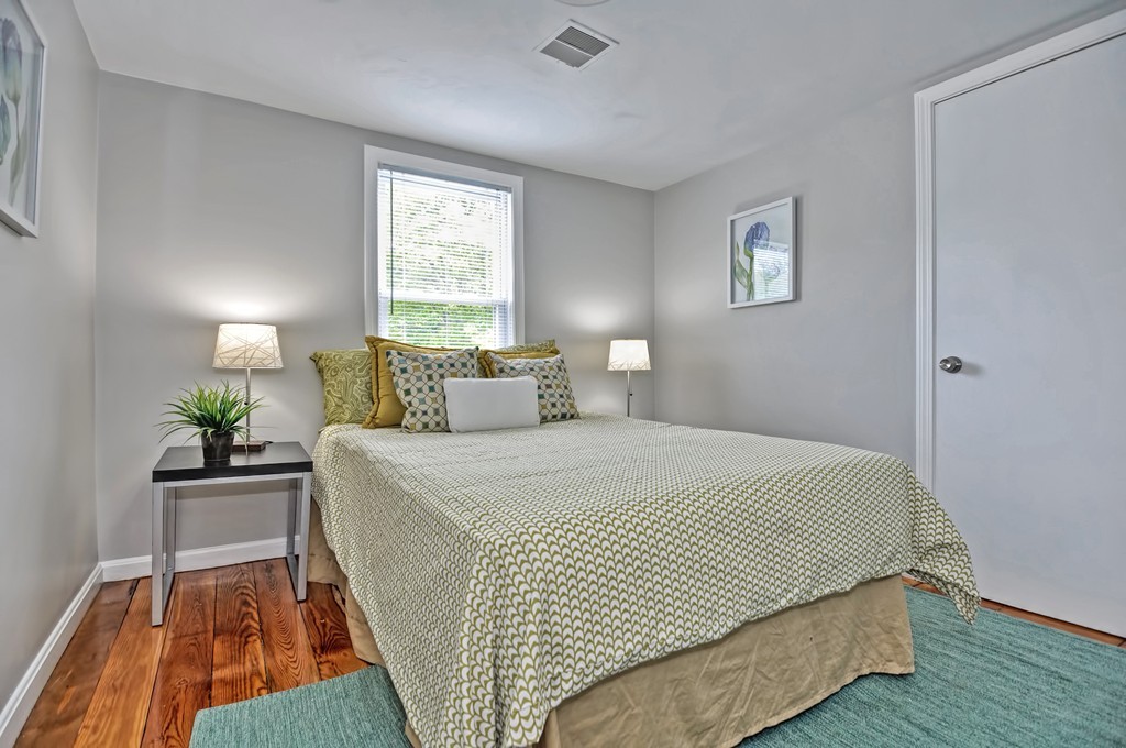 65 Edgewater Avenue Shrewsbury, MA 01545 - Photo 17 of 24 a bedroom with a bed and a window