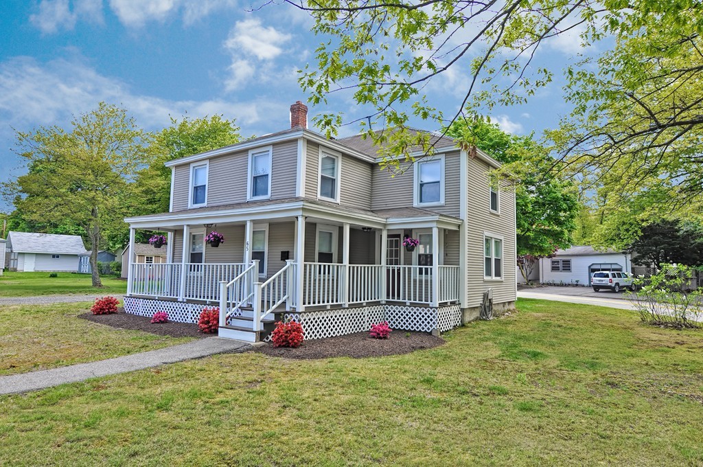 65 Edgewater Avenue Shrewsbury, MA 01545 - Photo 21 of 24 a view of a house with a big yard and large trees