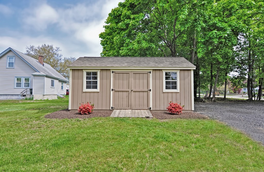 65 Edgewater Avenue Shrewsbury, MA 01545 - Photo 22 of 24 a front view of house with yard