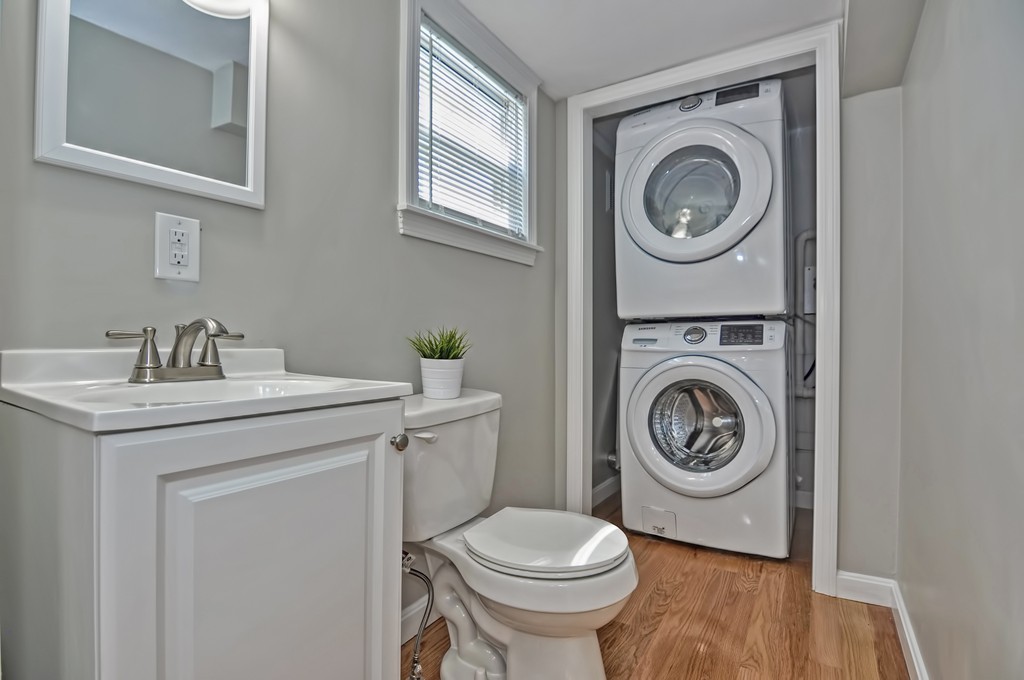 65 Edgewater Avenue Shrewsbury, MA 01545 - Photo 7 of 24 a view of a bathroom with a washer and dryer