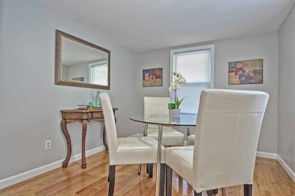 65 Edgewater Avenue Shrewsbury, MA 01545 - Photo 8 of 24 a view of a dining room with furniture and wooden floor