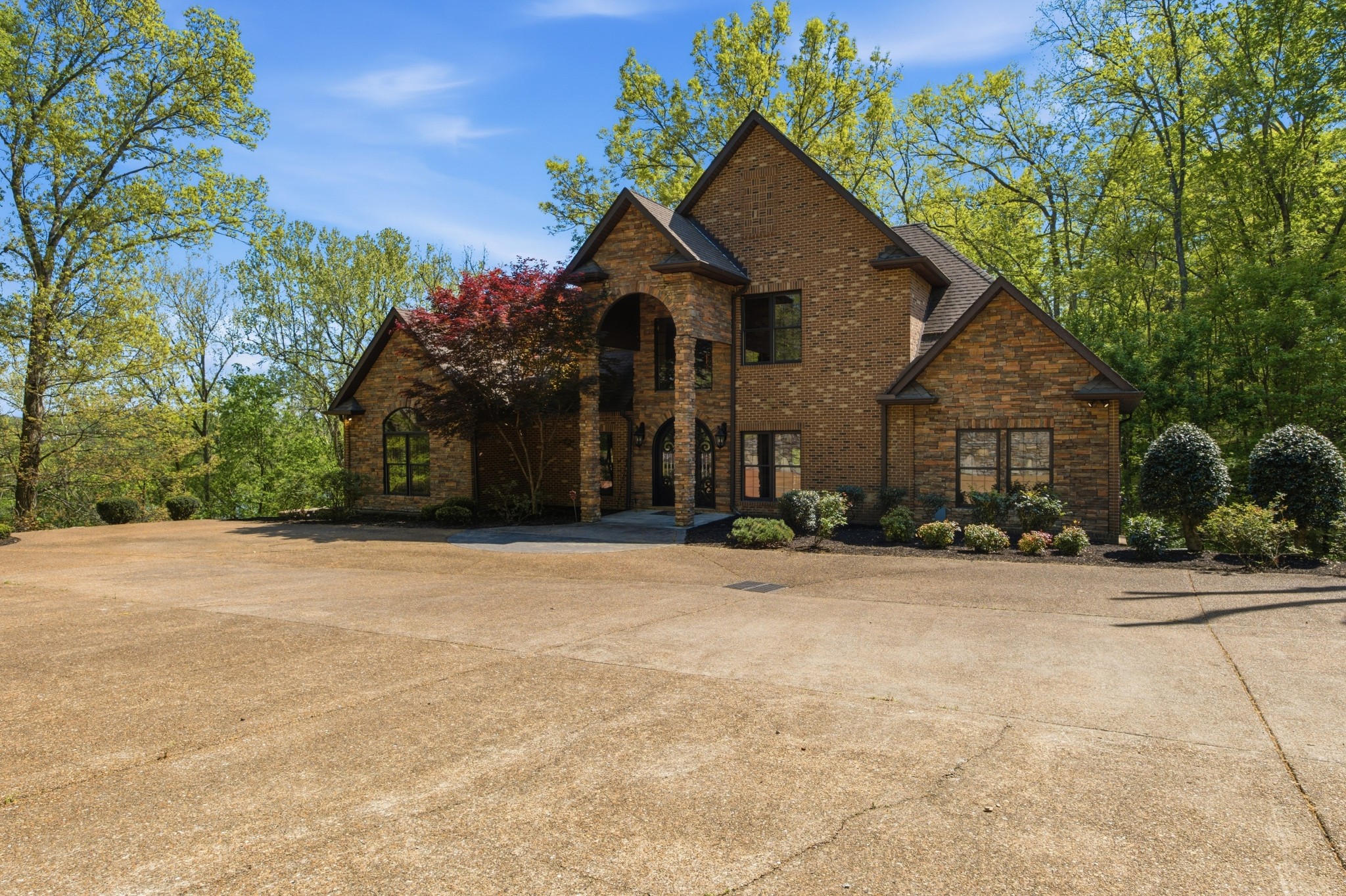 1605 Puryears Bend Road Hartsville, TN 37074 - Photo 2 of 63 a front view of a house with a yard and garage