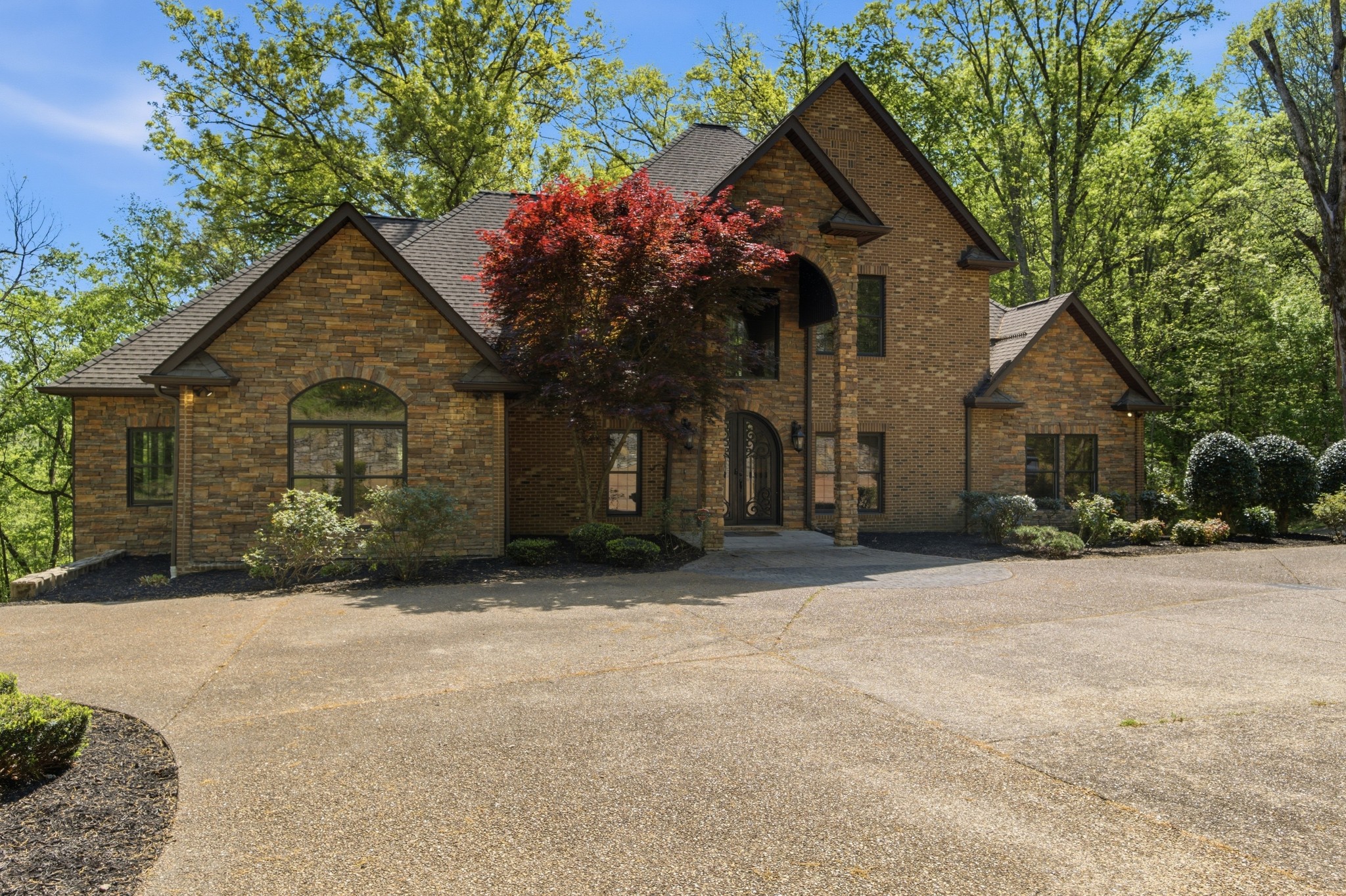 1605 Puryears Bend Road Hartsville, TN 37074 - Photo 3 of 63 a front view of a house with a yard and garage