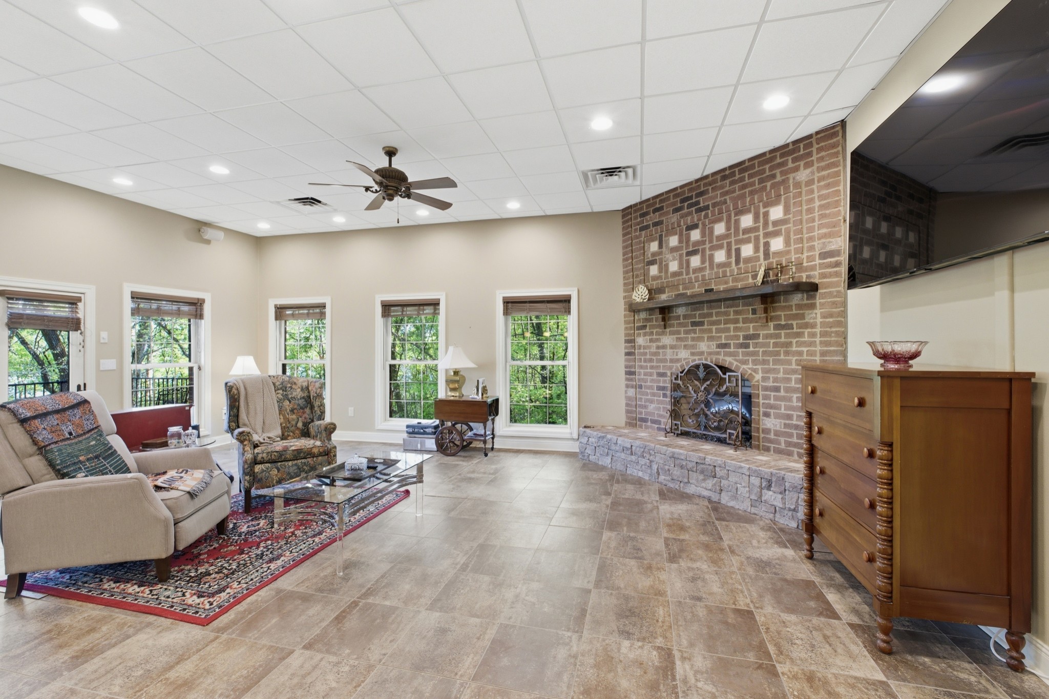 1605 Puryears Bend Road Hartsville, TN 37074 - Photo 41 of 63 a living room with furniture a fireplace and a flat screen tv
