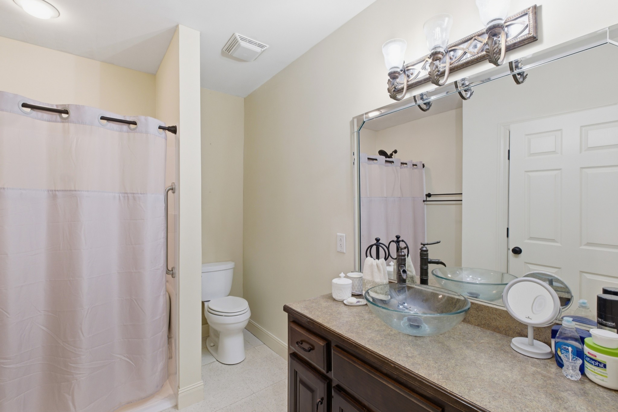 1605 Puryears Bend Road Hartsville, TN 37074 - Photo 45 of 63 a bathroom with a granite countertop sink toilet and a mirror