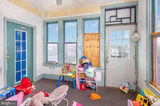 a bed room with a bed and a window