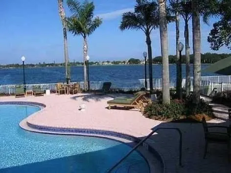 a view of swimming pool with a table and chairs