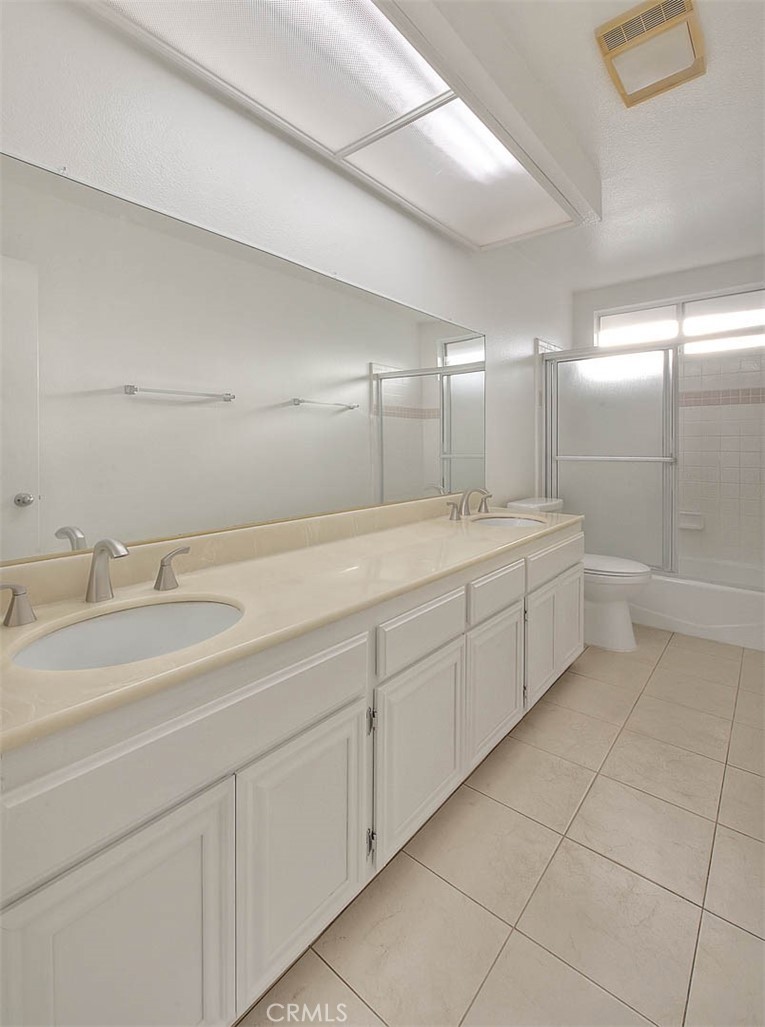2015 Morgan Lane, Unit B Redondo Beach, CA 90278 - Photo 13 of 19 a bathroom with a double vanity sink and a mirror