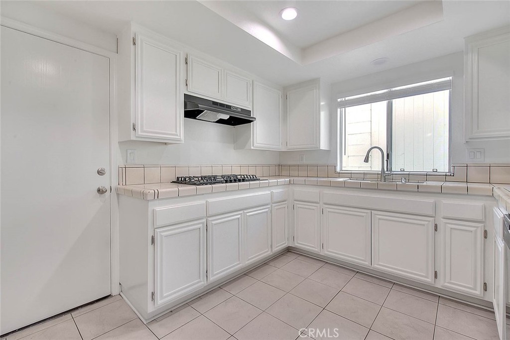 2015 Morgan Lane, Unit B Redondo Beach, CA 90278 - Photo 17 of 19 a kitchen with white cabinets and white appliances