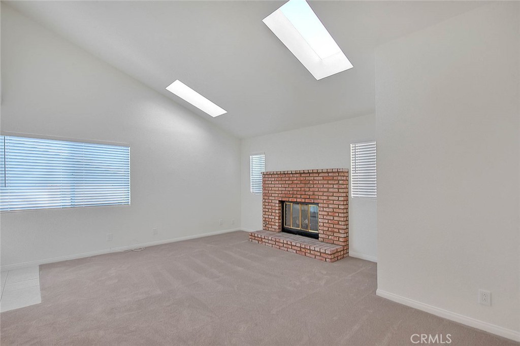2015 Morgan Lane, Unit B Redondo Beach, CA 90278 - Photo 4 of 19 an empty room with a fireplace